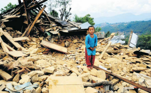 A Nepalese child in the earthquake rubble. (Photo from OLE Nepal's Indiegogo fundraising page)