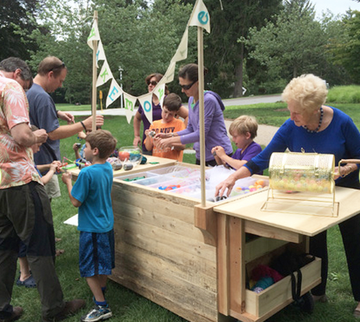 Selecting art supplies at last year's MAKEmobile at the deCordova.